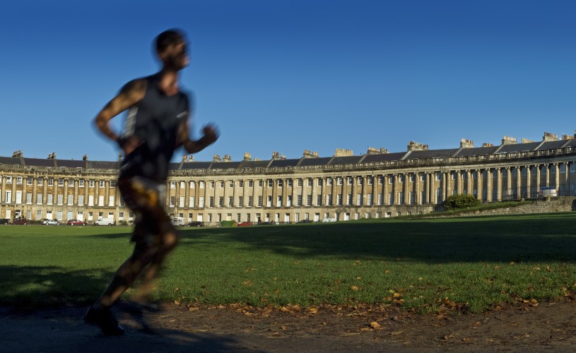 Person running past the Royal Crescent